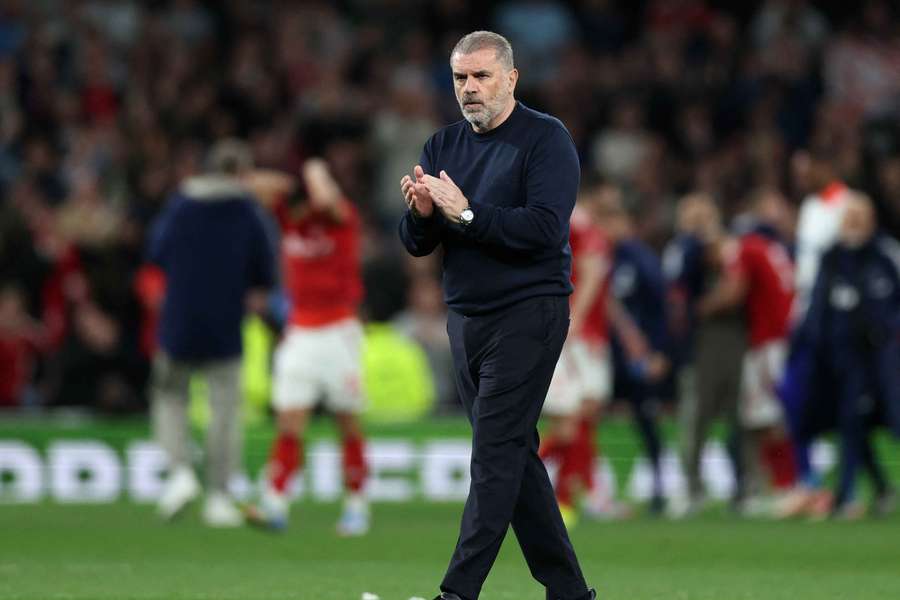 Tottenham manager Ange Postecoglou applauds fans after the match