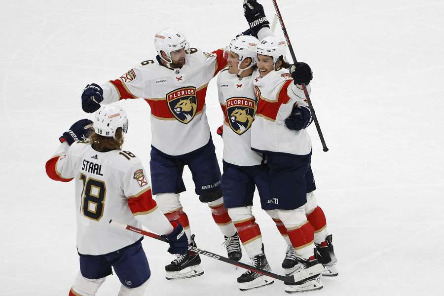 Panthers players celebrate scoring