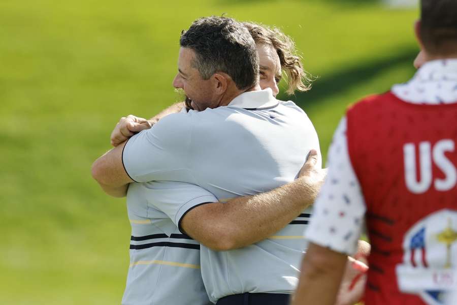 Fleetwood (L) and McIlroy (R) celebrate