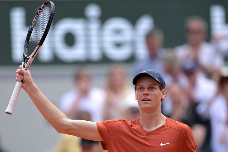 Jannik Sinner celebrates after winning against Grigor Dimitrov