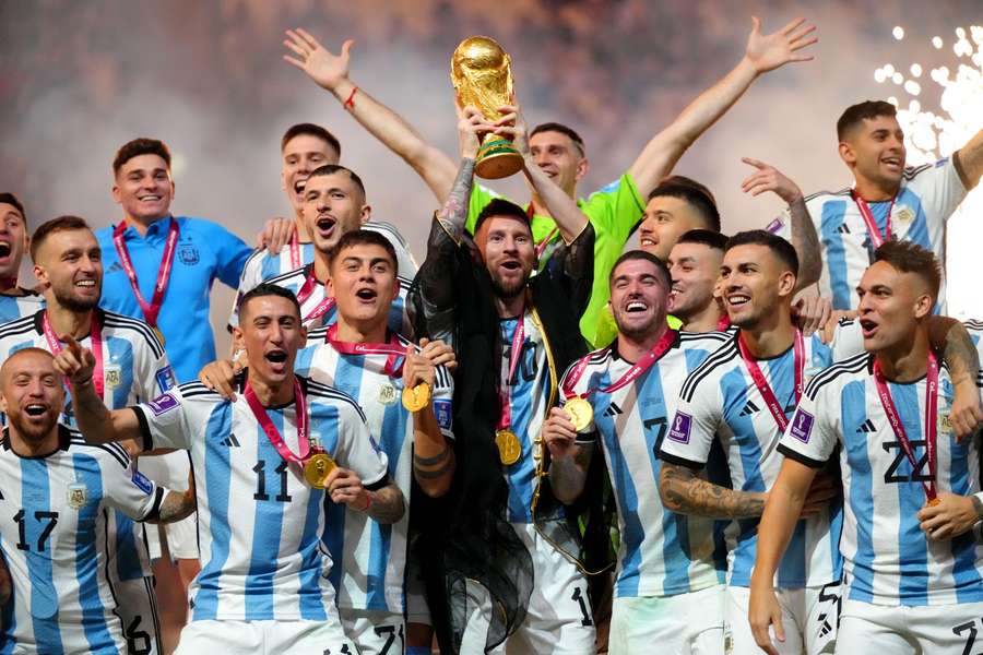 Lionel Messi lifts the FIFA World Cup trophy in Qatar.
