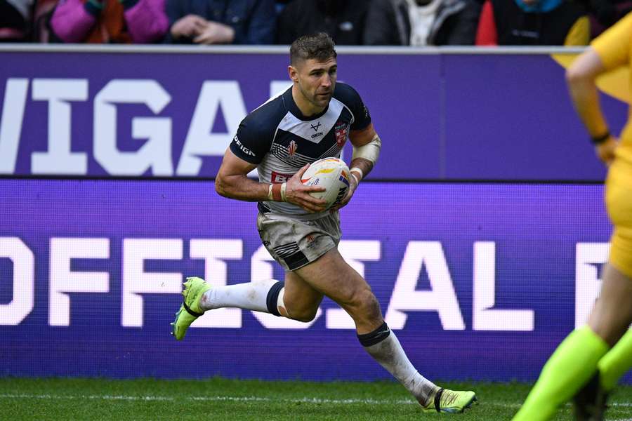 England's Tommy Makinson runs in another try during the 2021 rugby league World Cup quarter-final match between England and Papua New Guinea