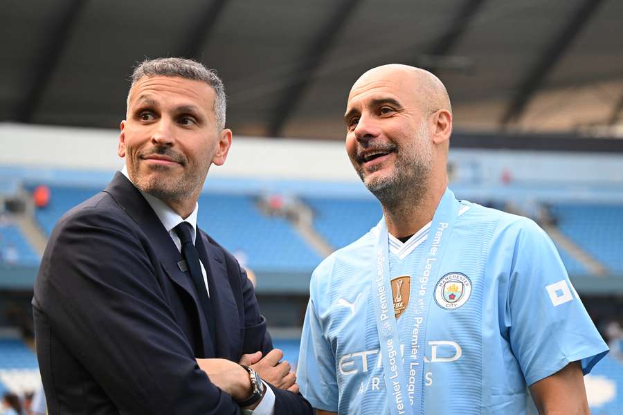 Manchester City chairman Khaldoon Al Mubarak (L) with former manager Pep Guardiola