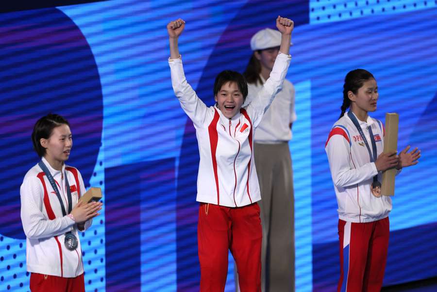 Gold medallist Quan Hongchan of China celebrates on the podium