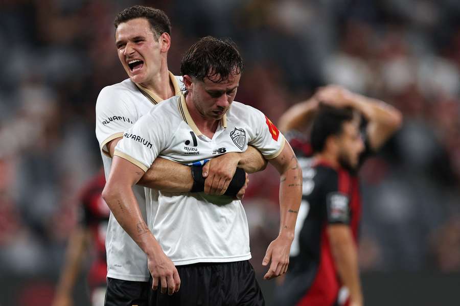 Louis Verstraete and Lachlan Brook celebrate one of the goals that moved Auckland to the top of the table.