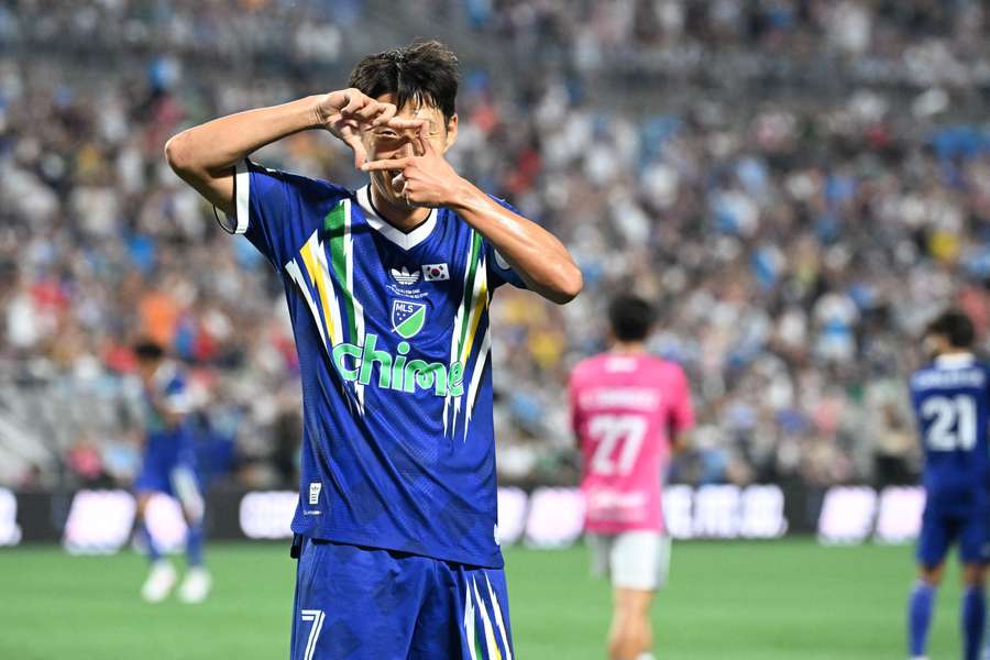 Son celebrates his goal Son celebrates his goal