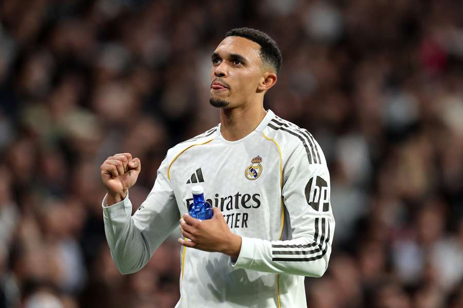 Trent Alexander-Arnold applauds the Real Madrid fans after beating Manchester City.