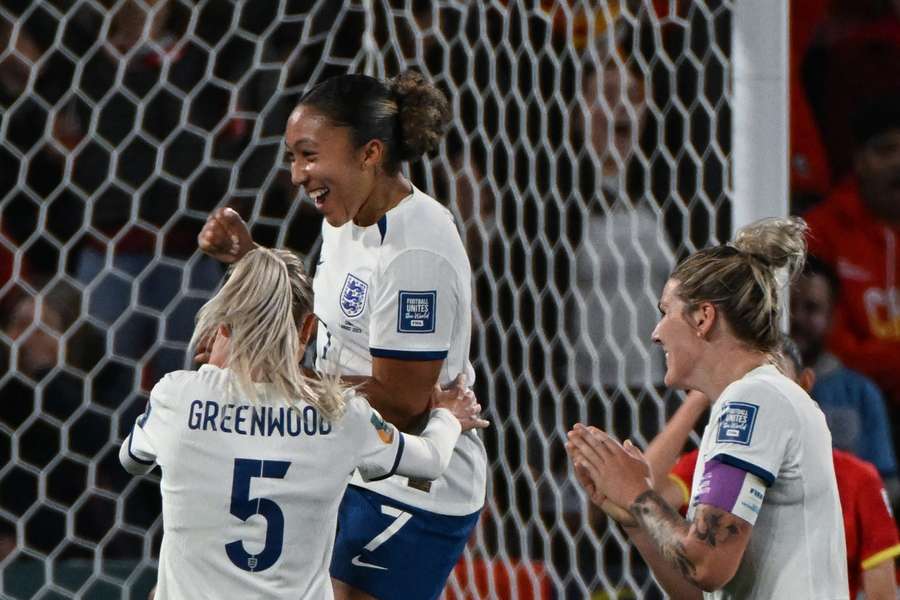 England's forward #07 Lauren James (C) celebrates with her teammates