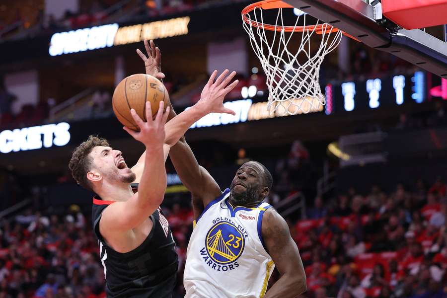 Houston Rockets' Alperen Sengun shoots against Draymond Green in their NBA Cup quarter-final win over the Golden State Warriors