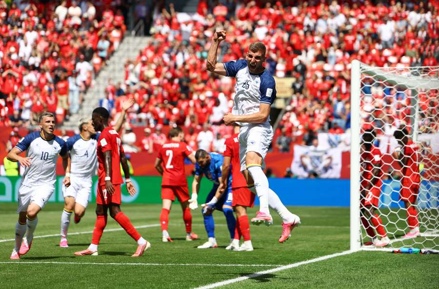 Bosnia and Herzegovina's Jovo Lukic celebrates scoring their first goal Bosnia and Herzegovina's Jovo Lukic celebrates scoring their first goal
