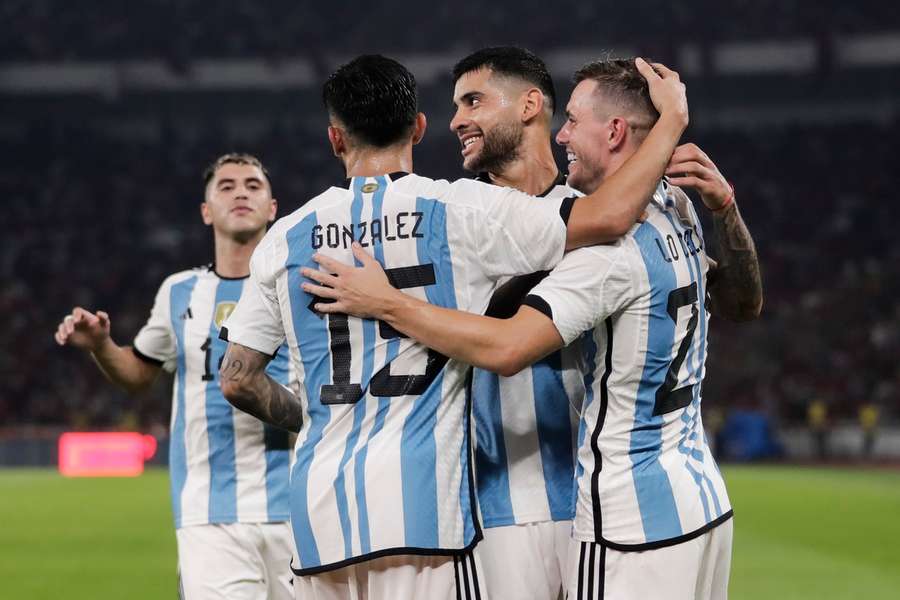 Romero celebrates his goal with teammates