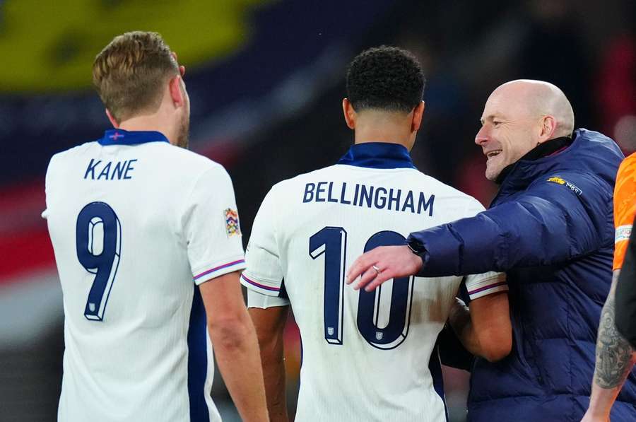 England Interim Head Coach Lee Carsley celebrates victory with Jude Bellingham