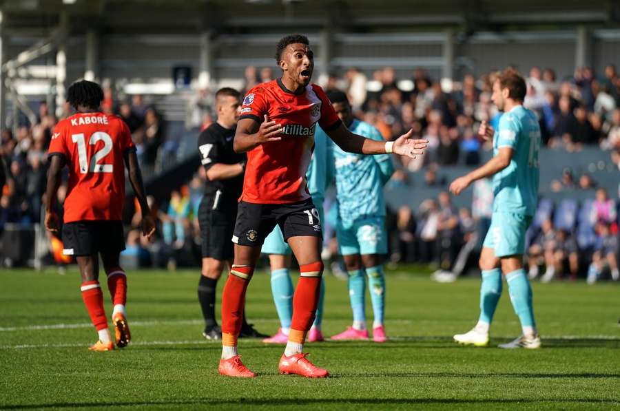 Luton Town's Jacob Brown reacts after being award a penalty 