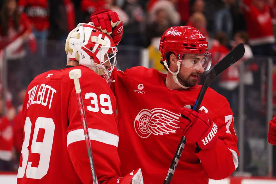 Detroit Red Wings players Cam Talbot (left) and Dylan Larkin (right) celebrating a win (2025)