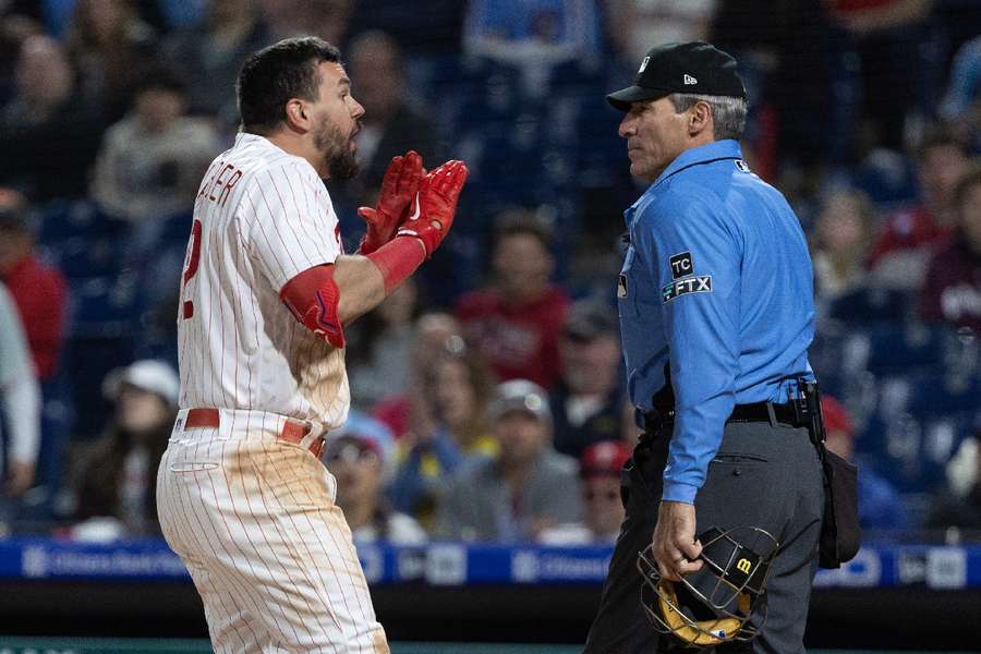 Philadelphia Phillies designated hitter Kyle Schwarber argues with umpire Angel Hernandez