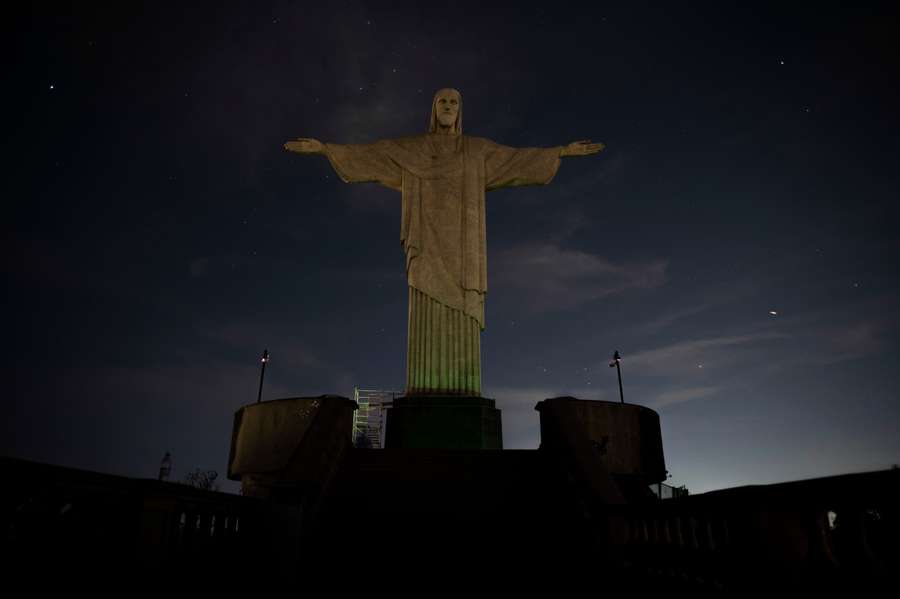 The Christ the Redeemer statue is seen without illumination to condemn racist acts against Vinicius Junior