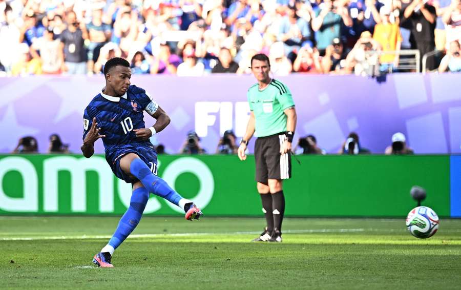 France's Kylian Mbappe scores their first goal from the penalty spot