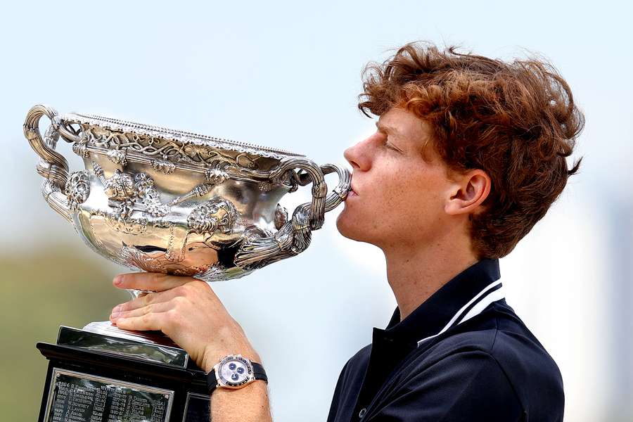 Jannik Sinner poses with the Norman Brookes Challenge Cup after winning the Australian Open earlier this year