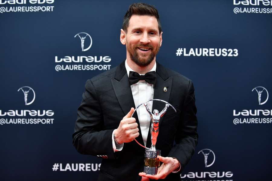 Argentinian football player Lionel Messi poses with his Laureus World Sportsman of the Year award