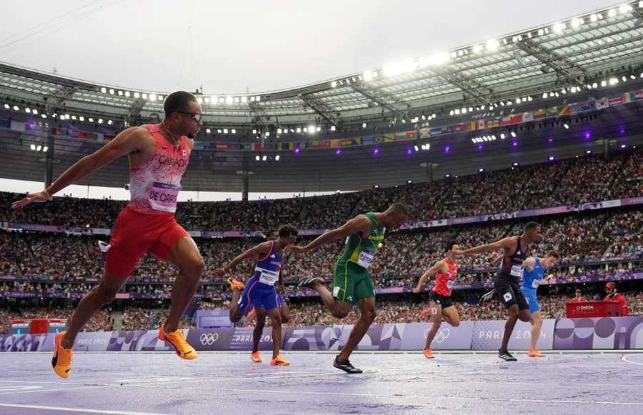 Andre de Grasse of Canada crosses the line to win gold