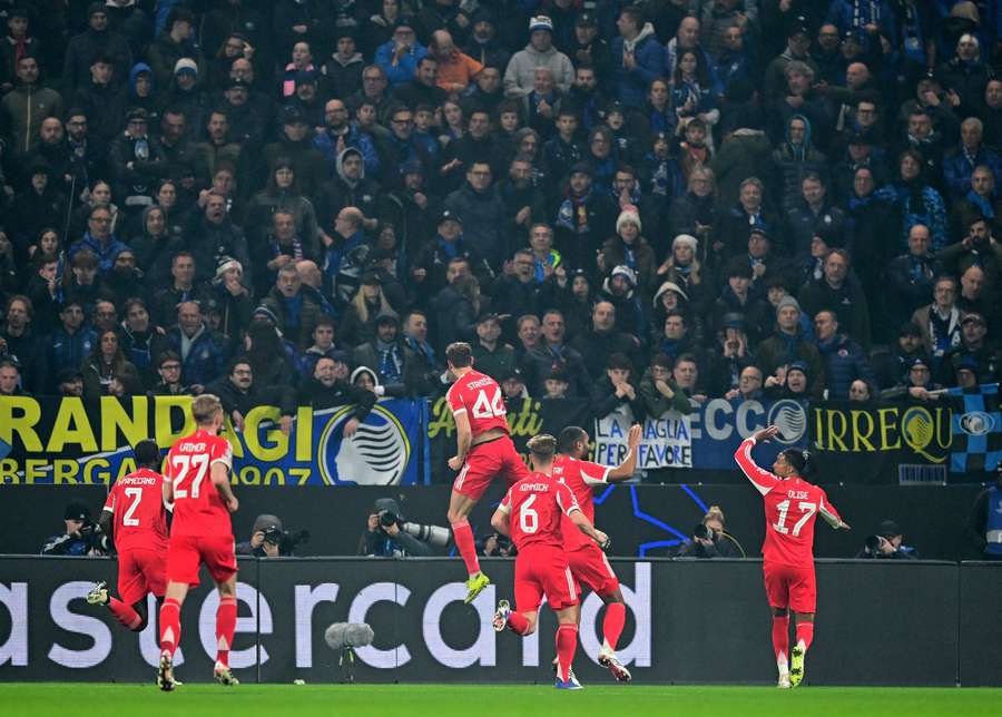 Bayern's players jump for joy after scoring in Bergamo