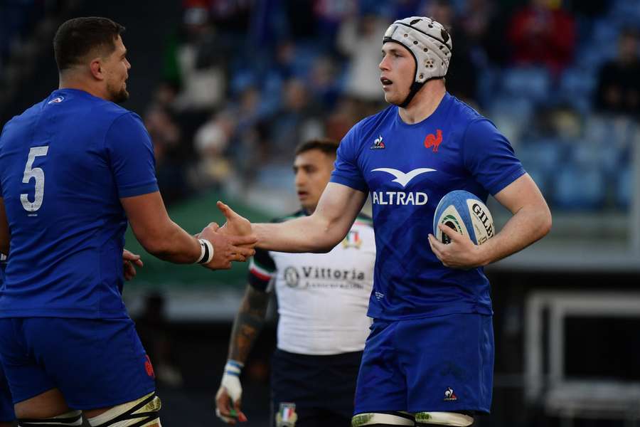 Thibaud Flament (R) celebrates with France's lock Paul Wilemse after scoring the first try against Italy