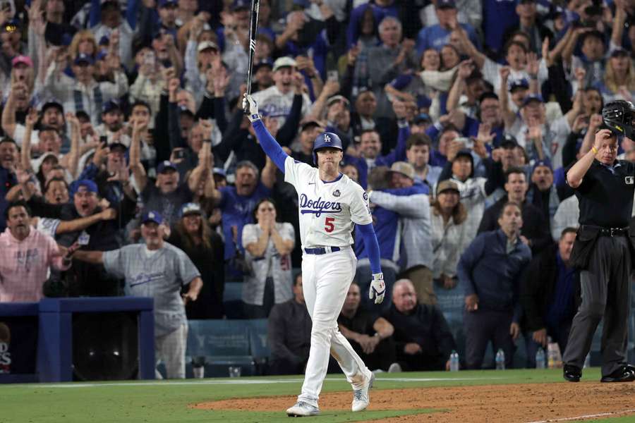 Freddie Freeman striking a pose after hitting the only walk-off grand slam in MLB Postseason history