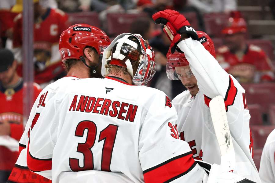 Frederik Andersen, Jordan Staal and Jesperi Kotkaniemi celebrate the win in Florida