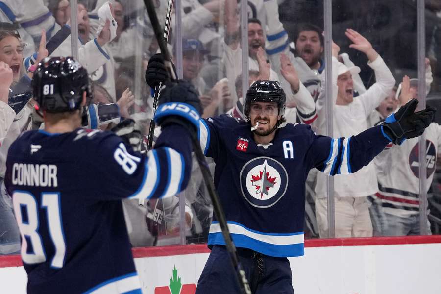 Mark Scheifele (right) celebrates his goal with teammate Kyle Connor in Game 5 vs. Dallas Stars (2025 Stanley Cup Playoffs)