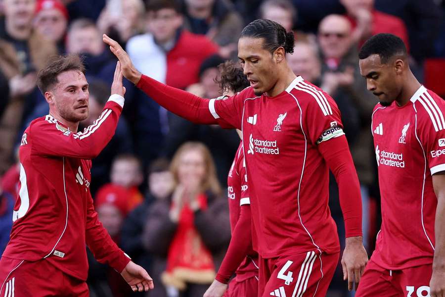 Liverpool's Virgil van Dijk (centre) celebrates scoring their second goal with Alexis Mac Allister Liverpool's Virgil van Dijk (centre) celebrates scoring their second goal with Alexis Mac Allister