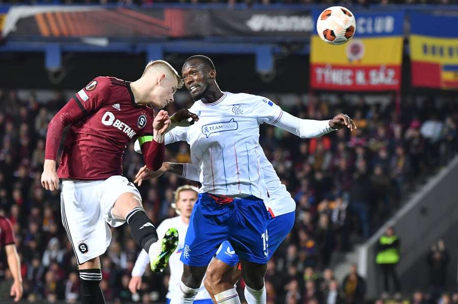 Sparta's Filip Panak and Abdallah Sima of Rangers battle in the air 