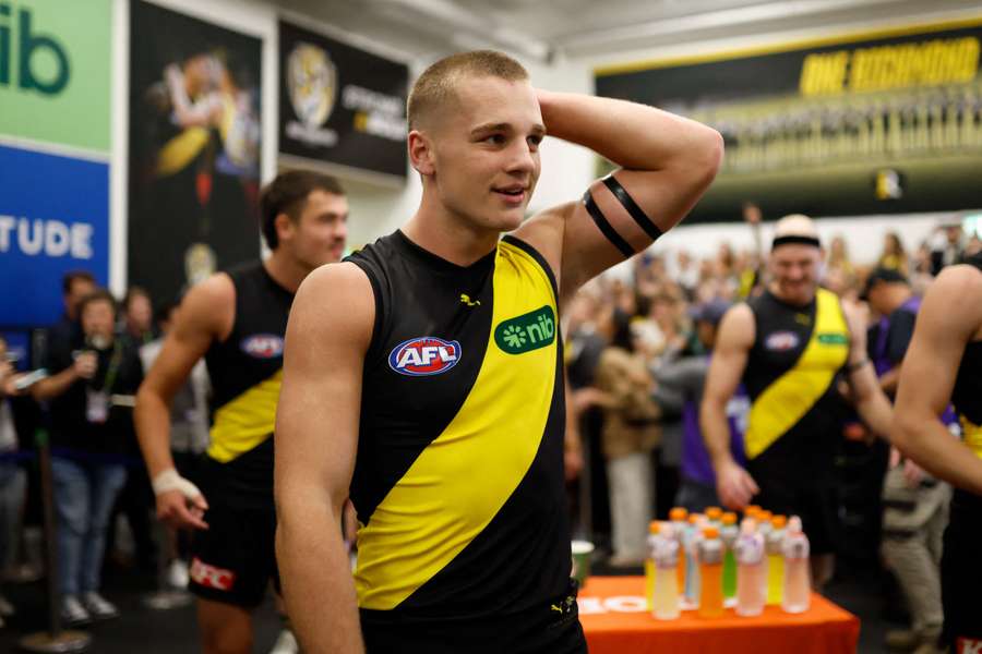 Sam Lalor in the changerooms after Richmond's AFL win over Carlton in Round 1.