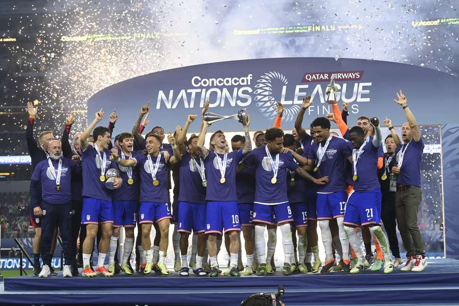 United States players celebrate capturing a third consecutive CONCACAF Nations League title by defeating Mexico 2-0 in the final