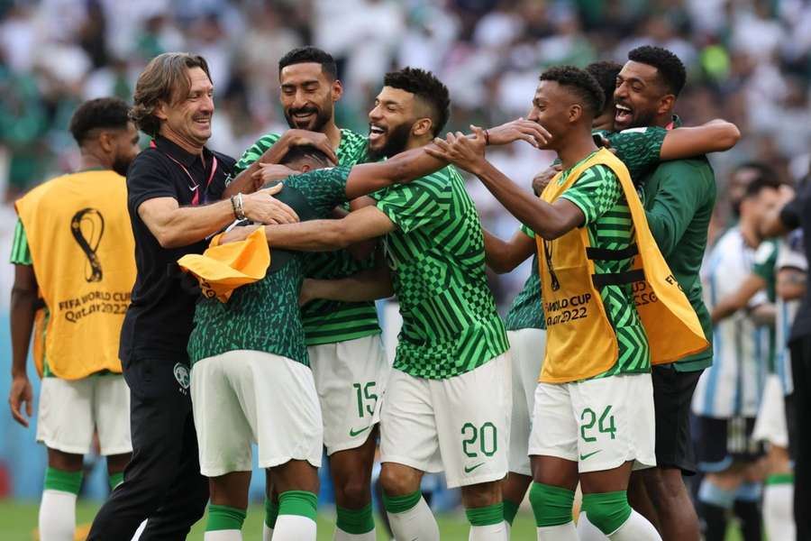 Saudi Arabia players celebrate their historic win over Argentina.