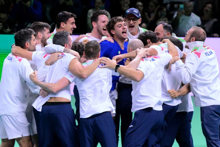 Italy's Flavio Cobolli (C) celebrates with teammates