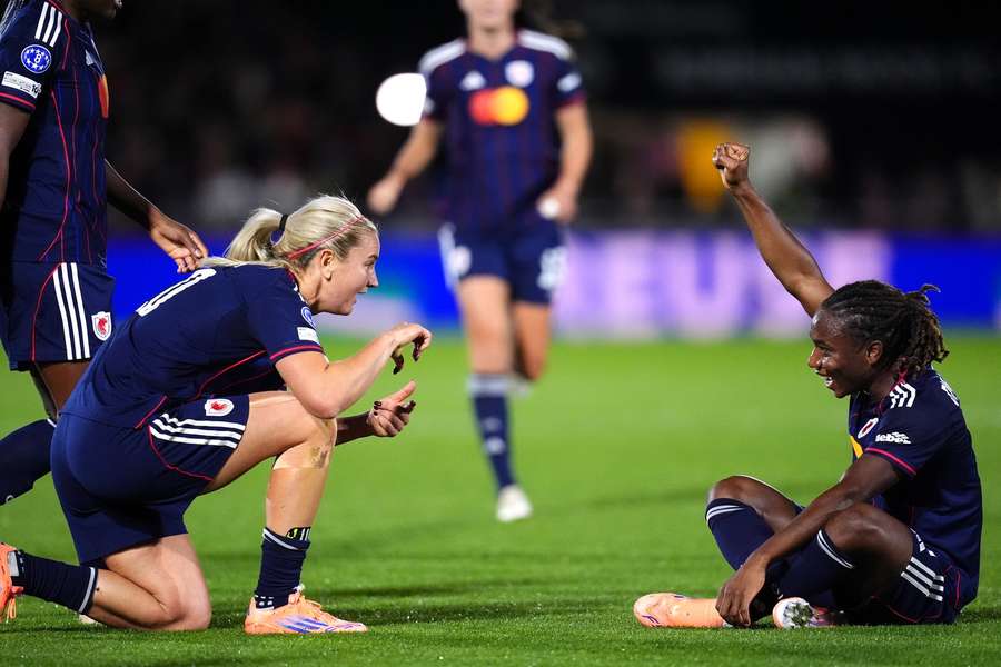 Melchie Dumornay (right) celebrates scoring Lyon's second goal against Arsenal