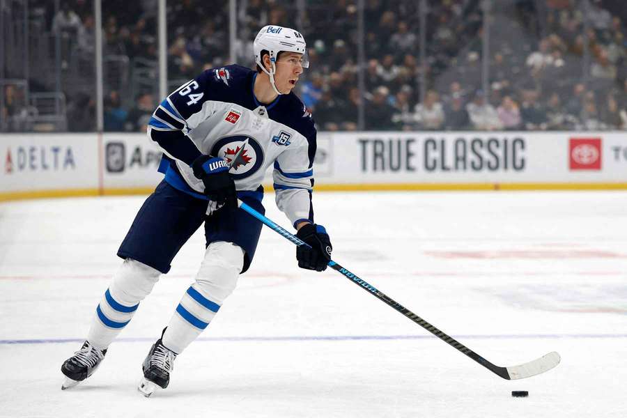 Logan Stanley handles the puck during a game