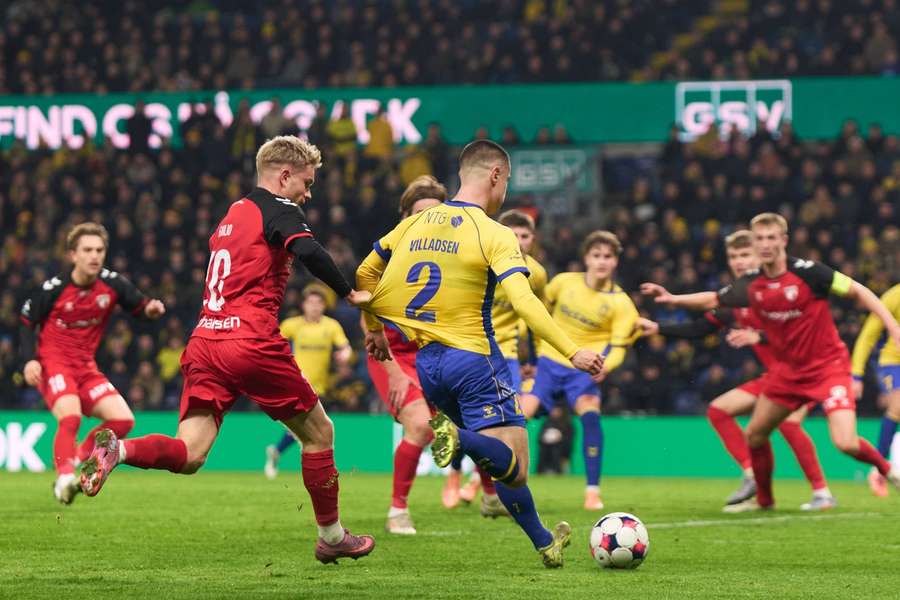 Fredericia's Emilio Simonsen pull the shirt of Brondby Oliver Marc Rose-Villadsen during Monday's clash
