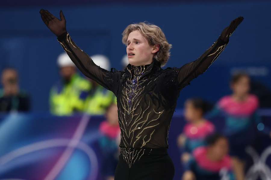 Figure skater Ilia Malinin reacts during Winter Olympics