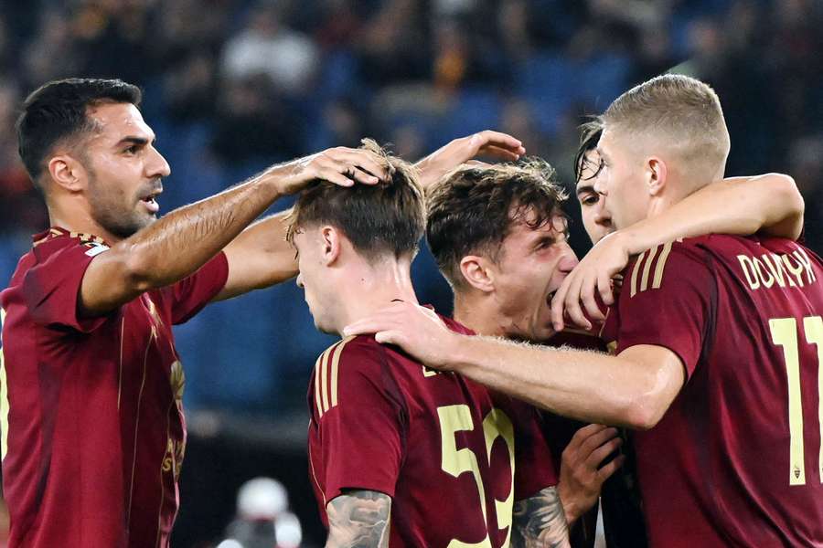 Artem Dovbyk of Roma celebrates with his teammates after scoring 