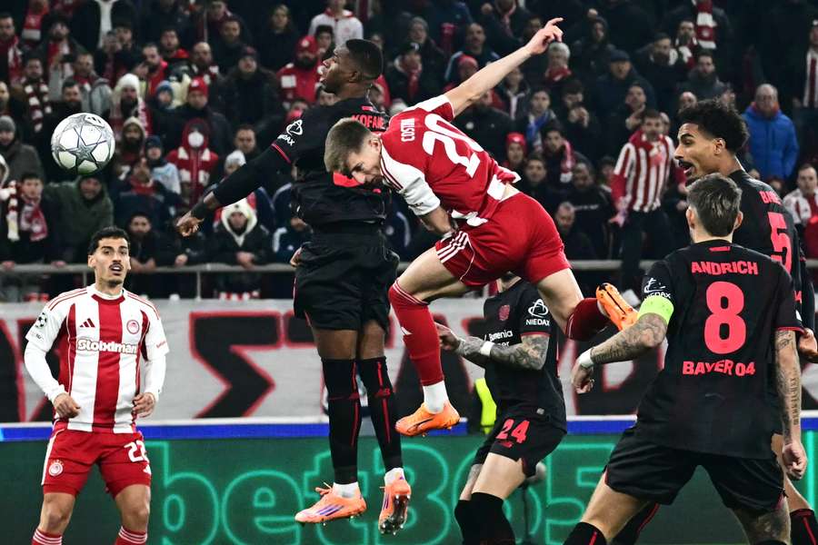 Olympiacos' Costinha heads the ball and scores his team's first goal against Bayer Leverkusen Olympiacos' Costinha heads the ball and scores his team's first goal against Bayer Leverkusen
