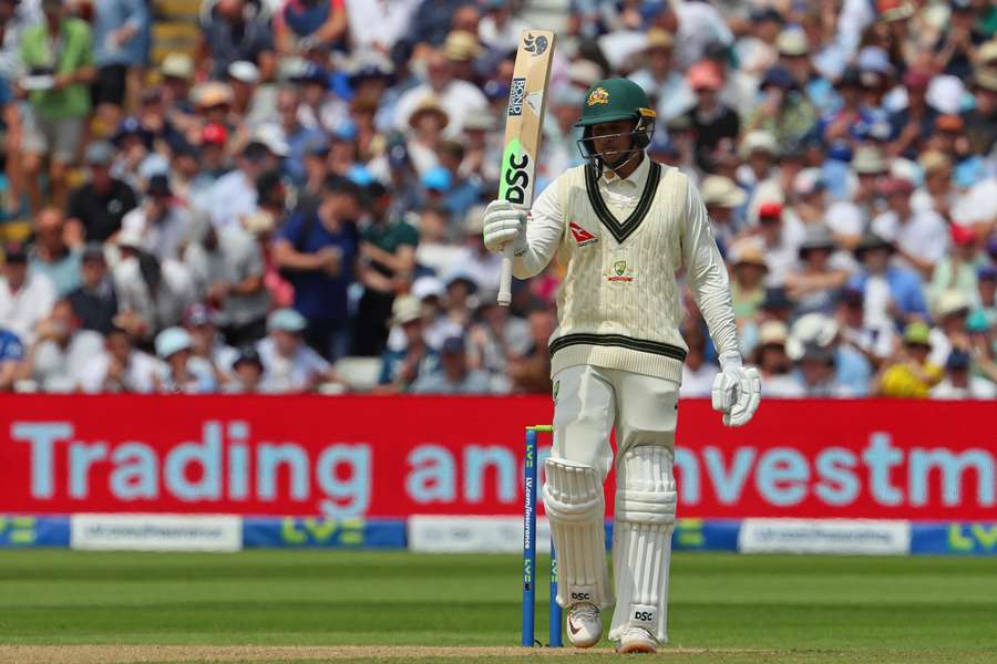 Australia's Usman Khawaja reacts to reaching his half century during play on day two of the first Ashes cricket Test match 