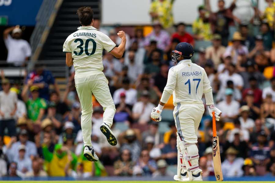 Pat Cummins of Australia celebrates after taking the wicket of Rishabh Pant of India