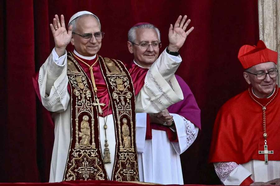 Pope Leo XIV gesturing to the crowd on the central loggia balcony of St. Peter's Basilica (2025)