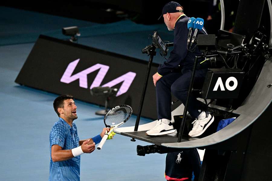 Djokovic speaks to the umpire during his match against Couacaud