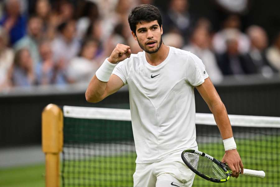 Carlos Alcaraz celebrates winning a point against Daniil Medvedev