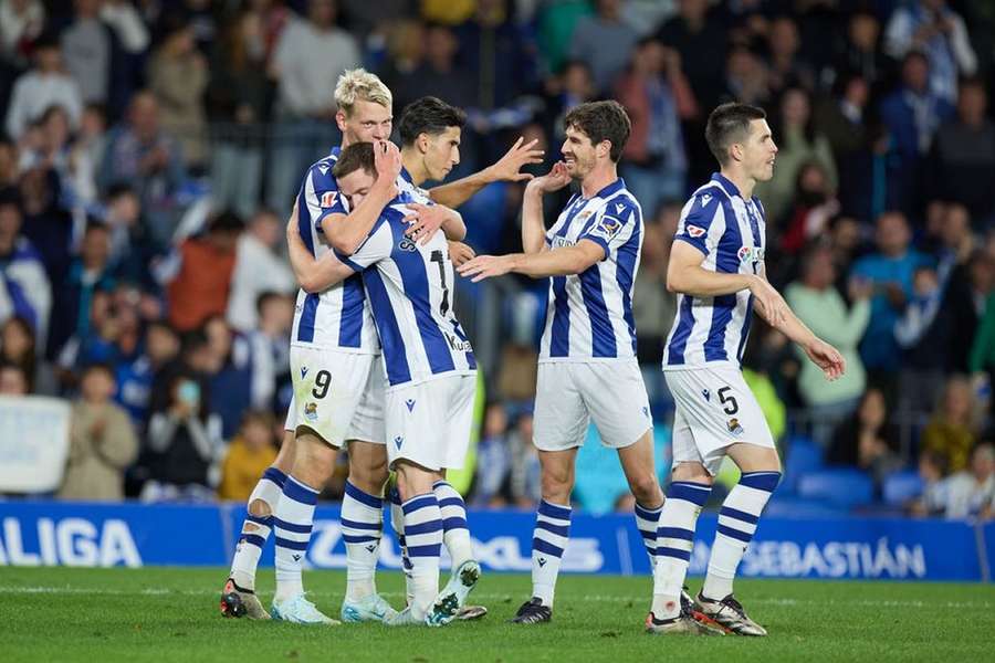 Ander Barrenetxea of Real Sociedad celebrates with teammate Mikel Oyarzabal after their team's first goal