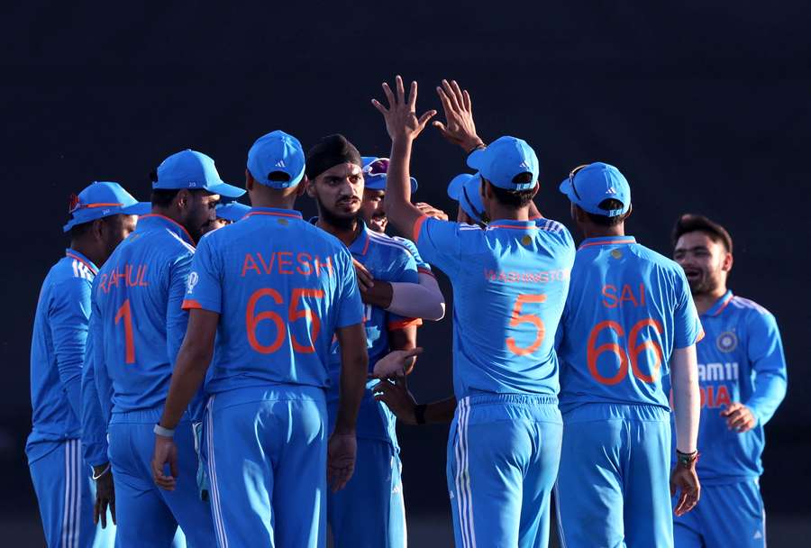 India's Arshdeep Singh celebrates with teammates after taking the wicket of South Africa's Tony de Zorzi