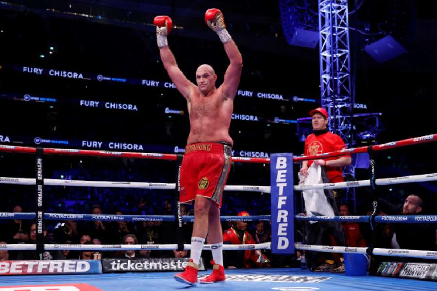 Fury celebrating after his last win against Chisora in December