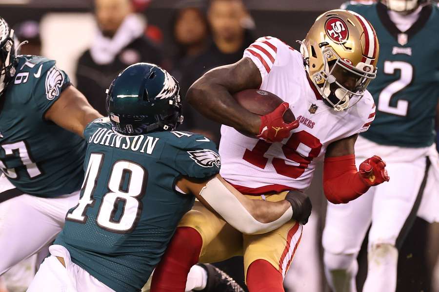 Patrick Johnson #48 of the Philadelphia Eagles tackles Deebo Samuel #19 of the San Francisco 49ers